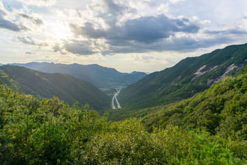 Arial view of the Highway to tunnel in South Korea  among high mountain.