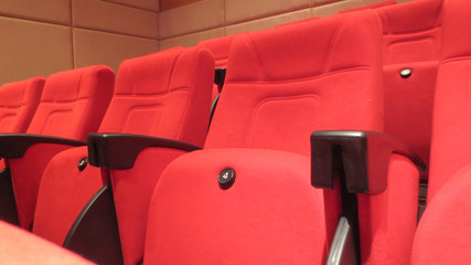 row of red seat in seminar hall