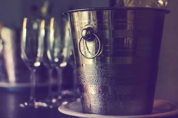 ice bucket close-up and wine glasses on table
