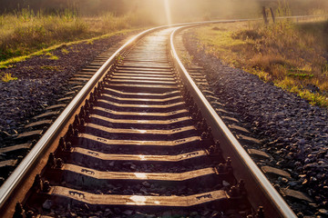 railroad tracks in the setting sun