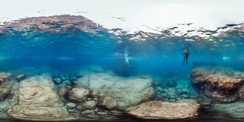 Diver over rocks in Brazil