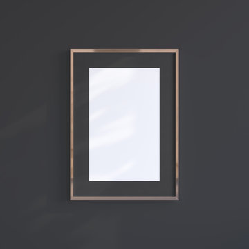 Copper blank frame on the black wall. Frame mock up.