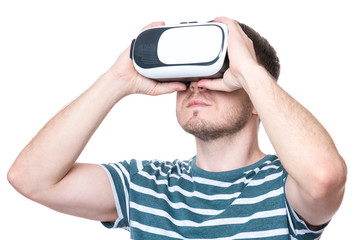 Man wearing virtual reality goggles watching movies or playing video games - closeup. Male looking in VR glasses, isolated on white background.
