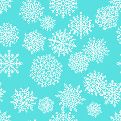 Christmas seamless pattern with white snowflakes on blue background. Vector illustration.