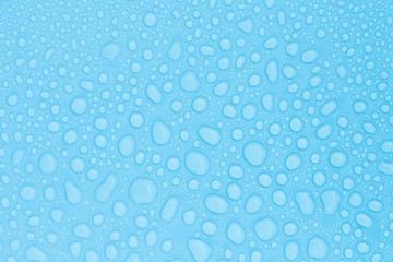 Fototapeta na wymiar closeup drops water on blue background
