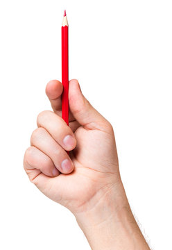 Male hand holding red pencil, isolated on white background.
