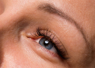 Beautiful grey woman single eye close up