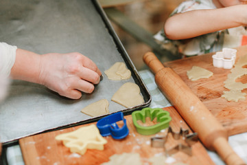 Obraz premium Child mixing flour in the kitchen, making dough