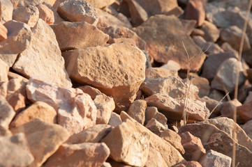 big pile of rocks and boulders piled with beautiful sunset light,