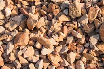 big pile of rocks and boulders piled with beautiful sunset light,