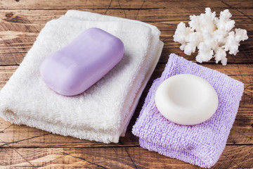 Spa and Wellness concept on wooden background. Soap and Terry towel.