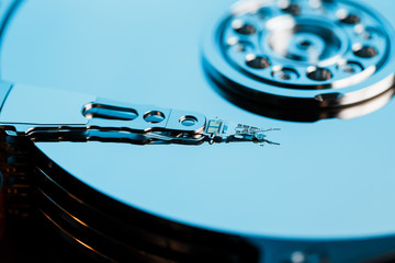 Disassembled hard drive from the computer, hdd with mirror effect. Opened hard drive from the computer hdd with mirror effects. Part of computer pc, laptop