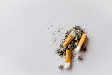 three cigarette butter and ash pile isolated on a white background, view from top,  copy space 