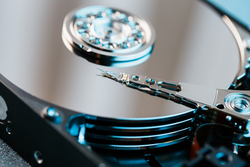 Disassembled hard drive from the computer, hdd with mirror effect. Opened hard drive from the...