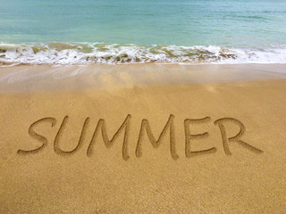 Summer written in the sand on a beautiful Brazilian beach.
