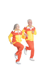 Fototapeta na wymiar Portrait of active senior couple exercising isolated on white