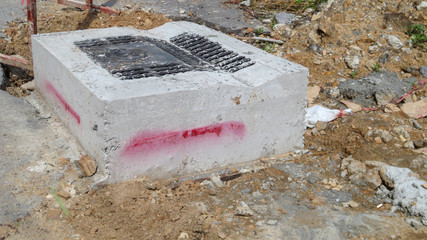 dirty road under construction and drain pipe at Thailand