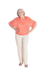 Portrait of a smiling senior woman posing isolated