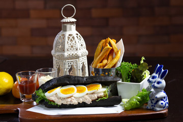 charcoal bread with egg and french fired potato