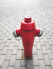 Metal red hydrant on the stove used to extinguish the fire