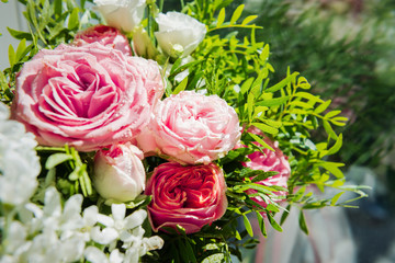 Obraz na płótnie Canvas Pink rose in a floral bouquet