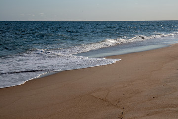 beautiful calm wave on a sandy beach