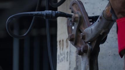 Focus on crimper at the staff working  connect the power cord.