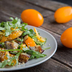 Healthy salad with grilled eggplant, greens and arugula.