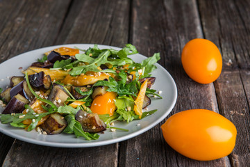 Healthy salad with grilled eggplant, greens and arugula.