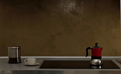 Cucina design moderna. Macchina caffè, tazzina. Piano cottura ad induzione