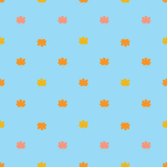 Seamless pattern with autumn maple leaves.  Yellow, orange and pink leaves on light blue background. Vector illustration