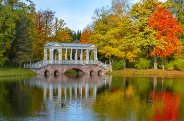 Marble bridge in golden fall in Catherine park, Pushkin, Saint Petersburg, Russia