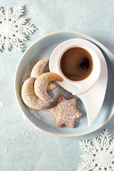 Vanillekipferl and cinnamon cookies. Christmas cookies and cup of freshly brewed coffee