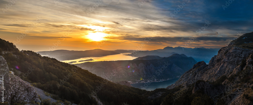 Wall mural panorama of mediterranean sea surrounded by mountains at colorful sunset