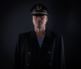portrait captain of the ship on a black background