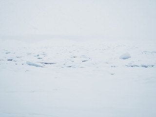 Trinity Bridge in a snowstorm in St. Petersburg.Icy river.