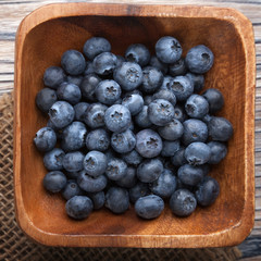 ripe sweet blueberries on wooden table
