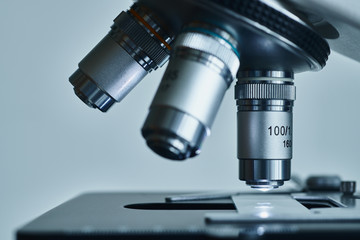 Obraz na płótnie Canvas Close-up shot of modern microscope with sample slide at laboratory.