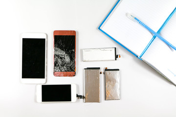 Electronic waste left over from the repair work of the mobile phone shop. Technician of mobile...