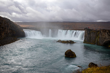 Icelandic waterfall in Icelandic natural landscape. Famous sights and attractions in Icelandic natural landscape on Southern Iceland