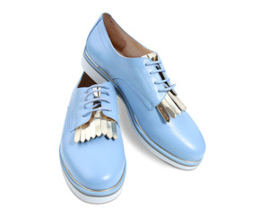 Women's blue shoes pair isolated.