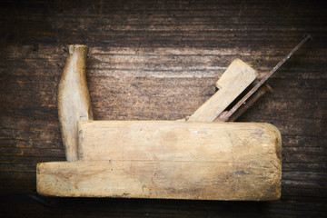 Carpenter tabletop with old hand plane. Traditional woodworking.