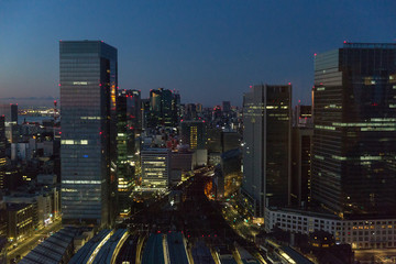 transportation and urban concept - view to tokyo city and railway station in japan at night