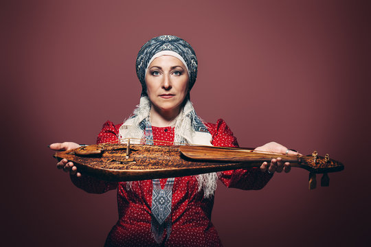 holding ancient violin