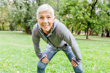  Active Senior Woman Doing Fitness Exercise In Nature