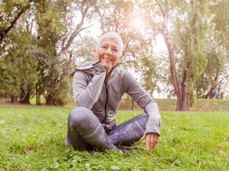 Naklejka na ściany i meble Happy Senior Woman Relax After Exercise In Nature