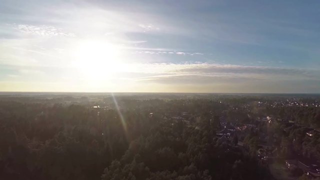 Aerial video of city Winsen near Celle in germany on sunny day with wide view on river and forest