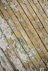 Cracked green paint surface. Rough old wood wall.