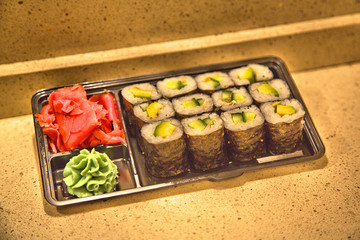 Set of rolls with cucumber and avocado. Ginger and wasabi
