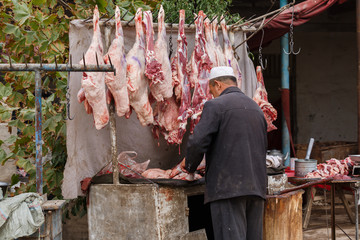 Butcher at Kashgar animal market